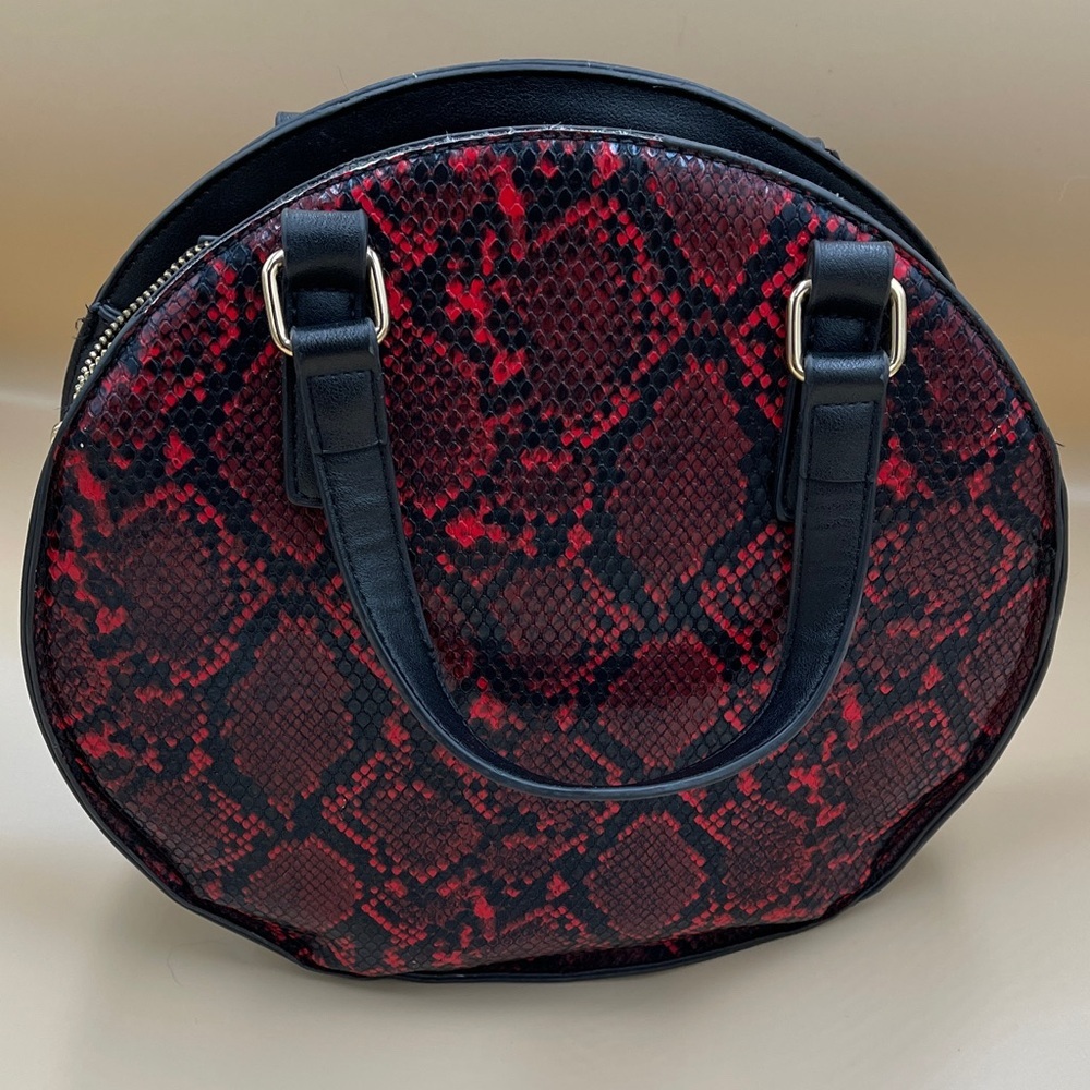 Kaari Blue Red and Black Snake-Print Mini Round Bag